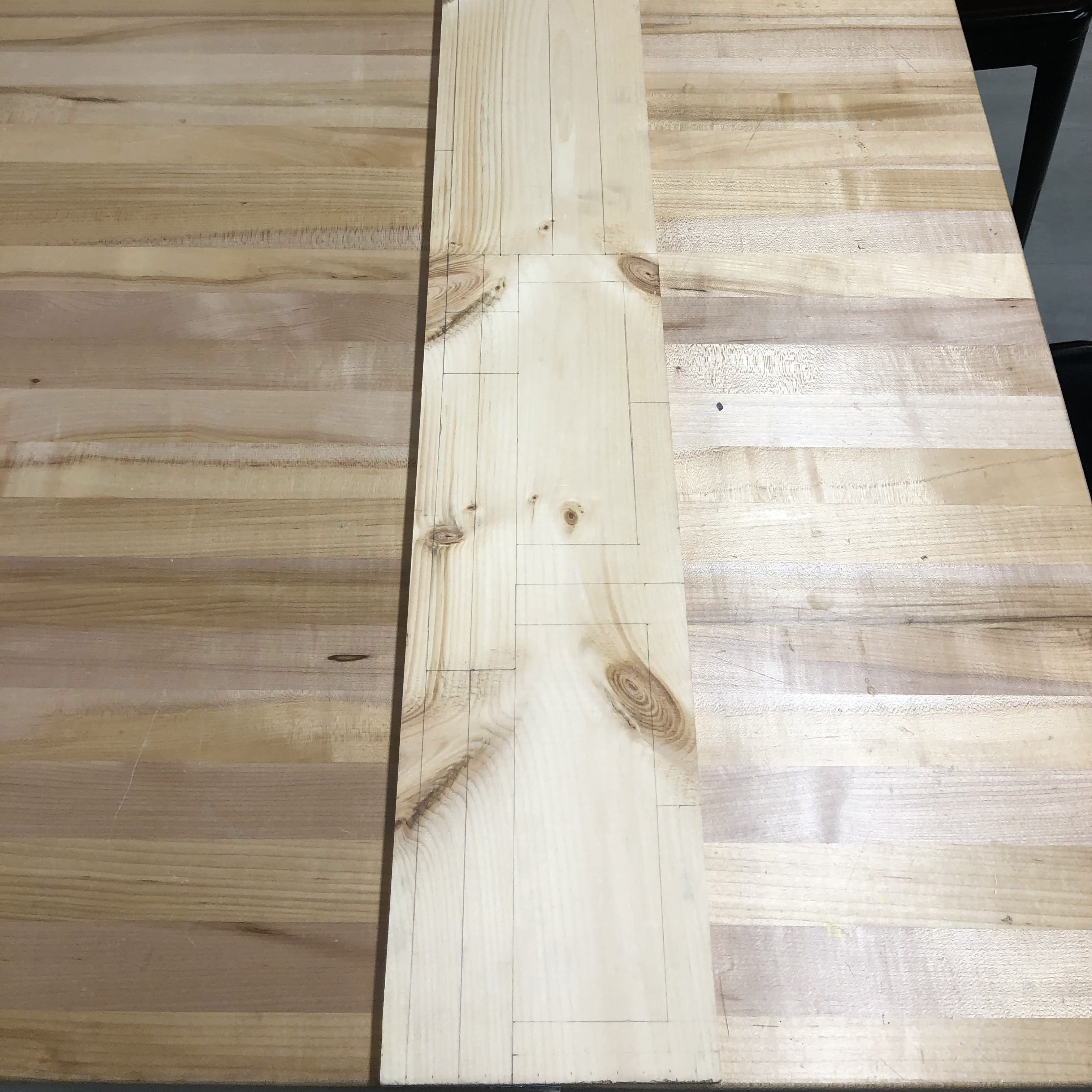 Plank with markings for cuts